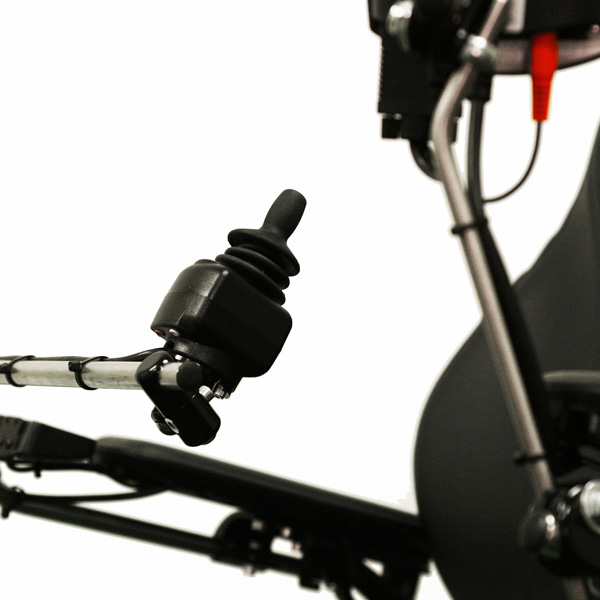 Close-up shot of the Permobil Compact Joystick, black rubber wheelchair control joystick from the right-side perspective