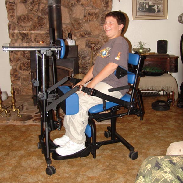 Teenage boy using the Prime Engineering Symmetry Youth Pediatric Standing Frame