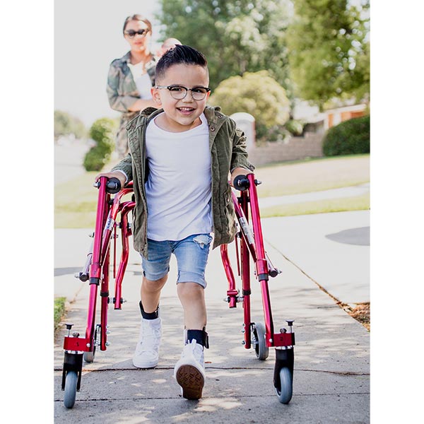 Little boy child using Nimbo Pediatric Posterior Walker