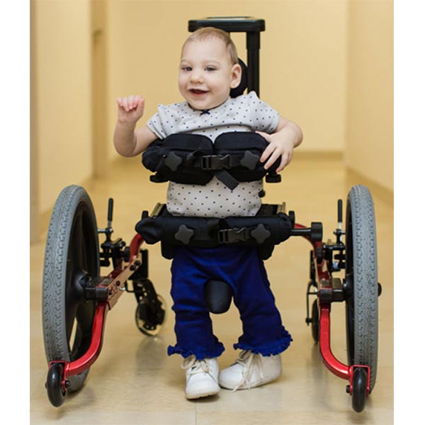 male toddler walking independently in the Prime Engineering KidWalk Pediatric Gait Trainer