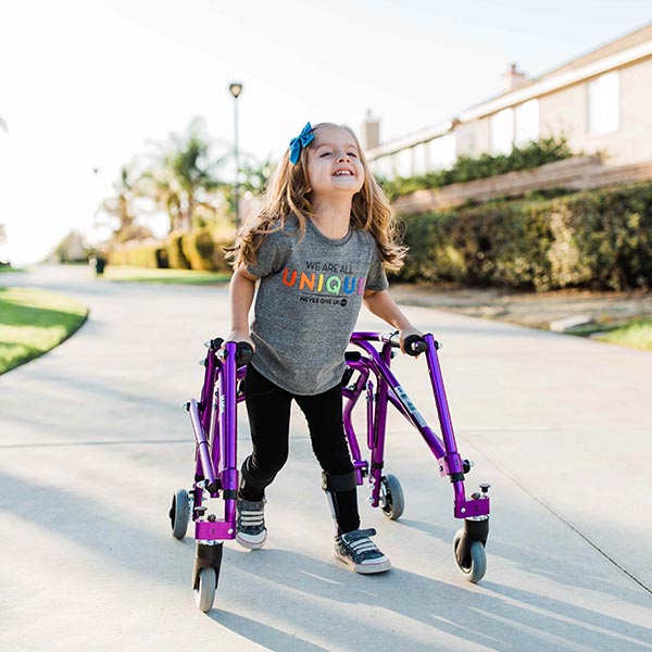 Little girl child using Nimbo Pediatric Posterior Walker