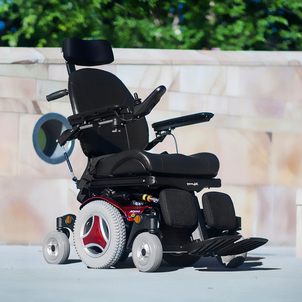 Man in elevated power wheelchair with joystick control