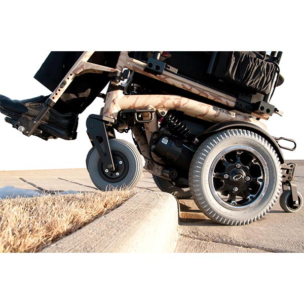 Sunrise Medical Quickie S-6 Series Electric Power Wheelchair dynamic suspension and wheels going over curb
